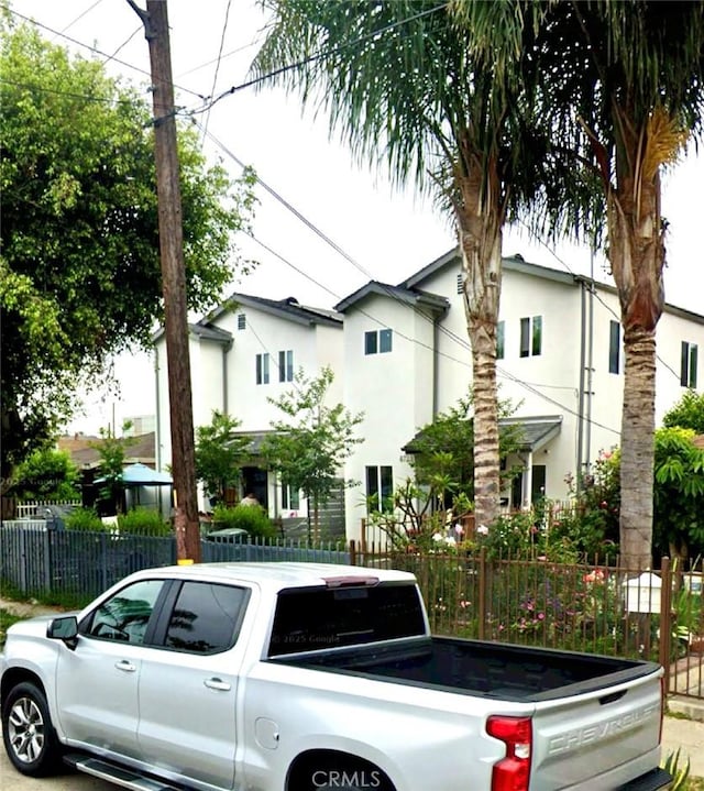 8725 Elm St, Los Angeles, CA 90002 - view of front facade with stucco siding and washer / dryer