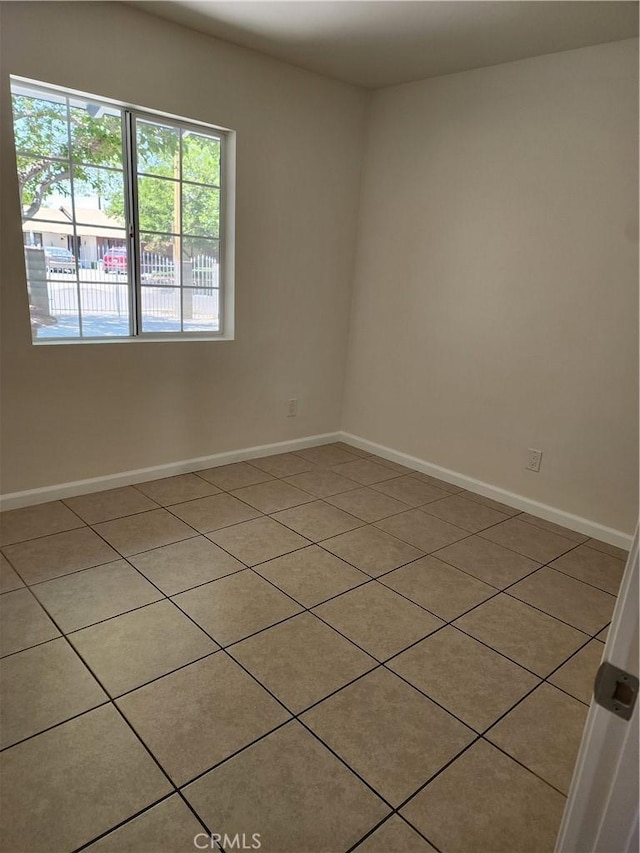 38638 Glenraven Ave, Palmdale, CA 93550 - empty room with light tile patterned floors and baseboards