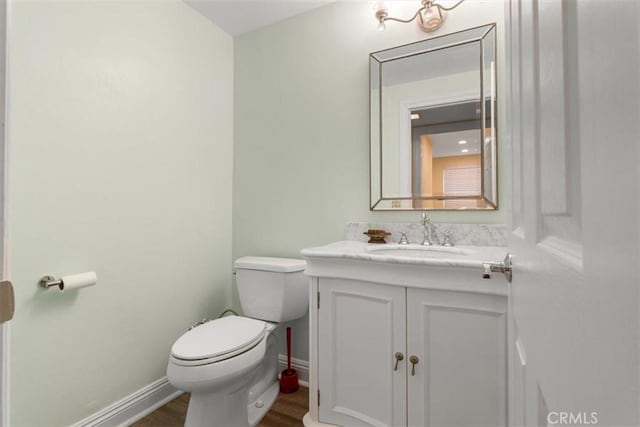 25912 Densmore Dr, Lake Forest, CA 92630 - half bathroom featuring vanity and wood finished floors