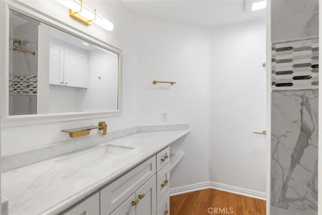 25912 Densmore Dr, Lake Forest, CA 92630 - full bath with vanity, wood finished floors, and a marble finish shower