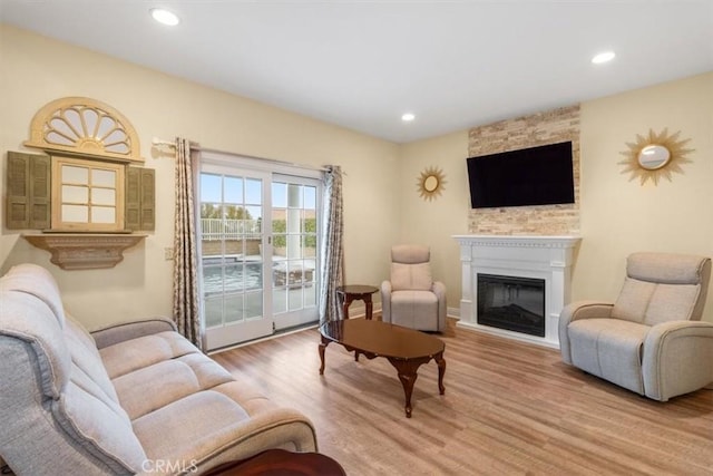25912 Densmore Dr, Lake Forest, CA 92630 - living area featuring light wood finished floors, a glass covered fireplace, and recessed lighting