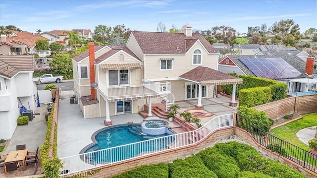 25912 Densmore Dr, Lake Forest, CA 92630 - back of house featuring a fenced backyard, a pool with connected hot tub, a patio area, a residential view, and stairway