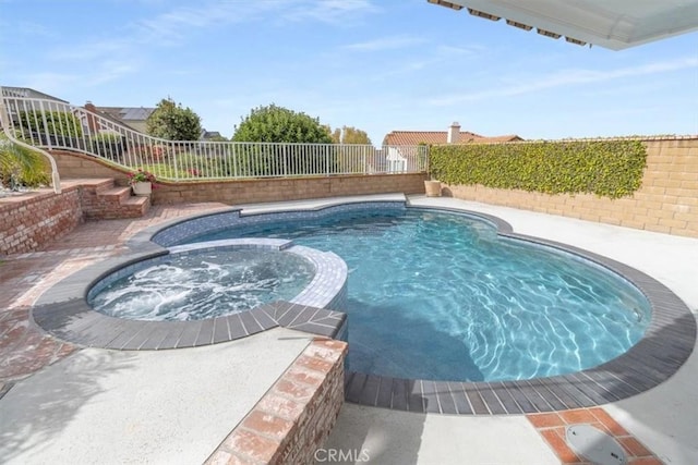 25912 Densmore Dr, Lake Forest, CA 92630 - view of swimming pool with a pool with connected hot tub and a fenced backyard