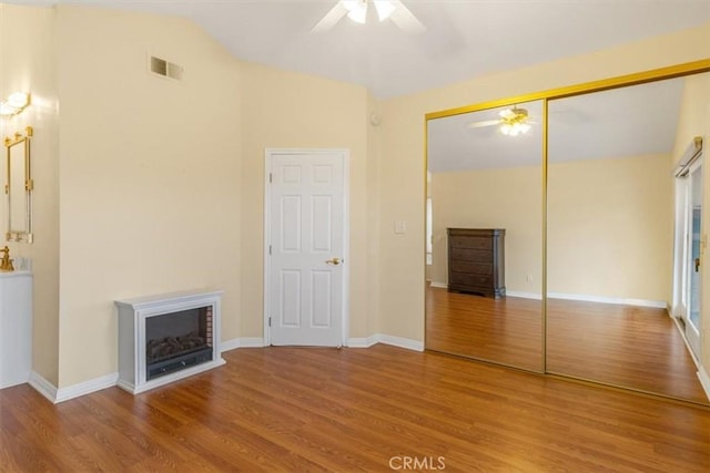 25912 Densmore Dr, Lake Forest, CA 92630 - unfurnished bedroom featuring wood finished floors, a fireplace, a closet, and ceiling fan