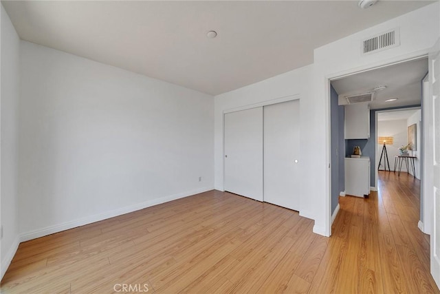 3687 Durfee Ave Unit 3, El Monte, CA 91732 - unfurnished bedroom with light wood-style floors and a closet