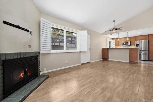 8350 Via Sonoma Unit A, La Jolla, CA 92037 - unfurnished living room featuring a fireplace, light wood-type flooring, lofted ceiling, and a ceiling fan