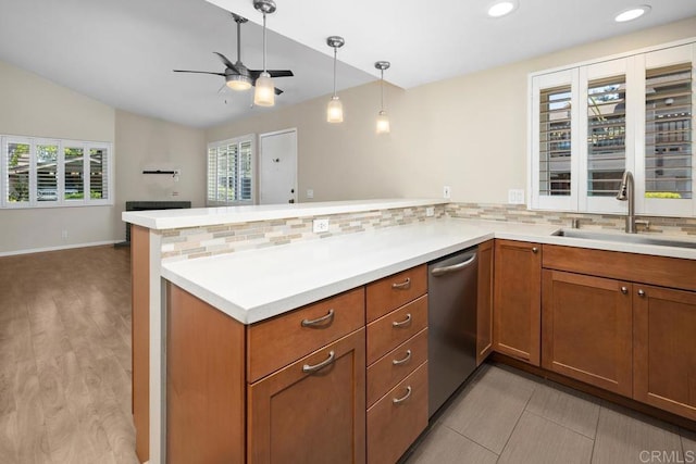 8350 Via Sonoma Unit A, La Jolla, CA 92037 - kitchen with stainless steel dishwasher, decorative backsplash, a ceiling fan, a peninsula, and vaulted ceiling