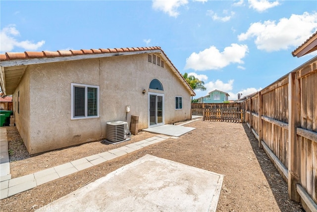 25671 Roylene Dr, Menifee, CA 92586 - rear view of house featuring a fenced backyard, a patio, and stucco siding