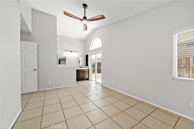 25671 Roylene Dr, Menifee, CA 92586 - empty room with ceiling fan, high vaulted ceiling, and light tile patterned floors