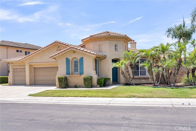 11567 Waterwell Ct, Riverside, CA 92505 - mediterranean / spanish home with a garage, driveway, stucco siding, a front yard, and a tile roof