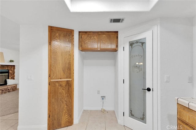 12490 Palomino Ln, Apple Valley, CA 92308 - bathroom featuring tile patterned floors and a fireplace