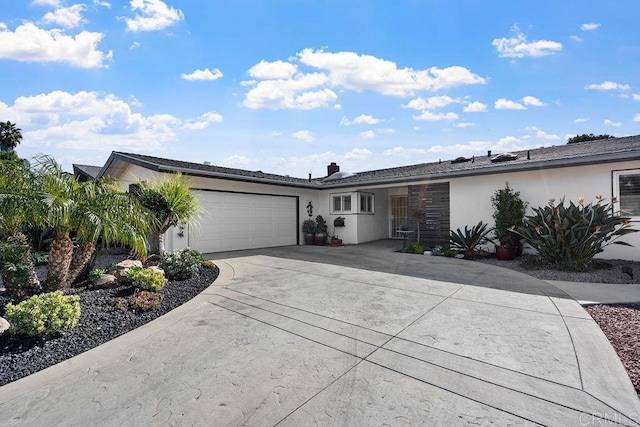 3185 Monroe St, Carlsbad, CA 92008 - ranch-style house with a garage, concrete driveway, stucco siding, and a chimney