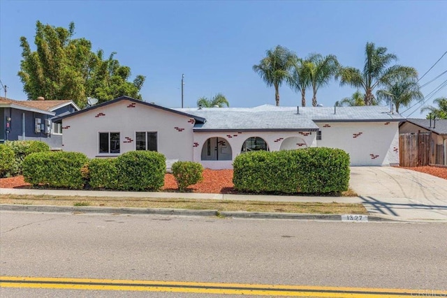 1327 Walbollen St, Spring Valley, CA 91977 - view of front facade with concrete driveway and stucco siding