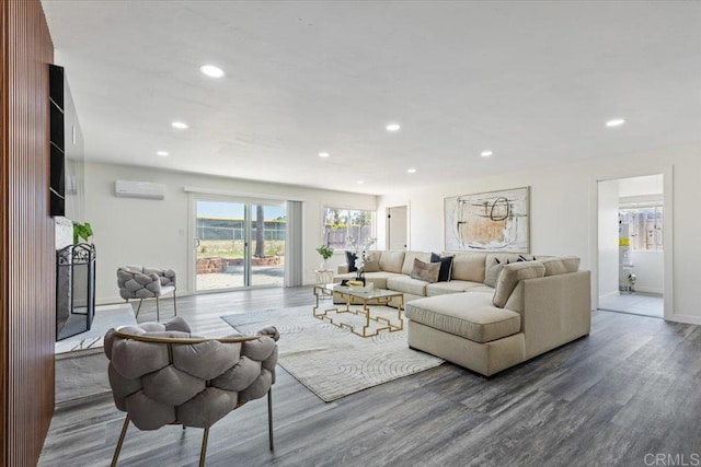 1327 Walbollen St, Spring Valley, CA 91977 - living area with a wall unit AC, wood finished floors, and recessed lighting