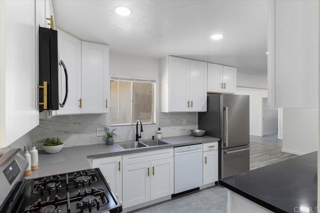 1327 Walbollen St, Spring Valley, CA 91977 - kitchen featuring range with gas cooktop, white dishwasher, freestanding refrigerator, white cabinetry, and recessed lighting