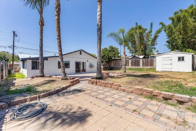 1327 Walbollen St, Spring Valley, CA 91977 - back of house featuring a patio area, a fenced backyard, and a shed