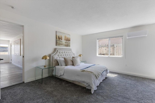1327 Walbollen St, Spring Valley, CA 91977 - bedroom with an AC wall unit, carpet flooring, and a textured ceiling