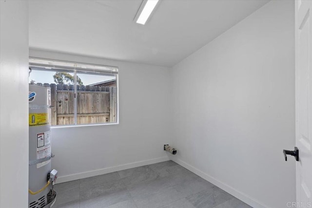 1327 Walbollen St, Spring Valley, CA 91977 - laundry area featuring secured water heater and baseboards
