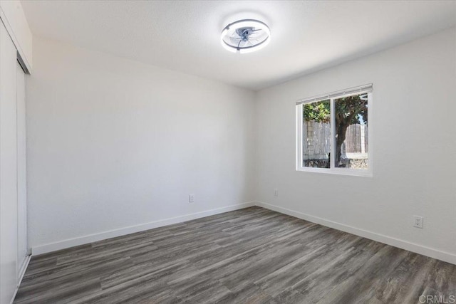 1327 Walbollen St, Spring Valley, CA 91977 - empty room with dark wood-type flooring and baseboards