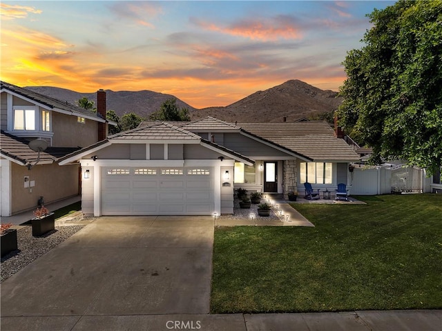 13220 February Dr, Corona, CA 92879 - view of front of house with a mountain view, a garage, driveway, and a tiled roof