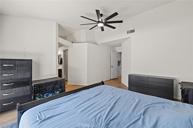 13220 February Dr, Corona, CA 92879 - bedroom with wood finished floors, a ceiling fan, and high vaulted ceiling