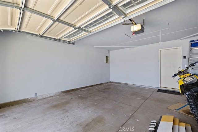13220 February Dr, Corona, CA 92879 - garage with a garage door opener and baseboards