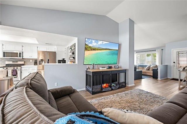 13220 February Dr, Corona, CA 92879 - living room with vaulted ceiling and light wood-type flooring