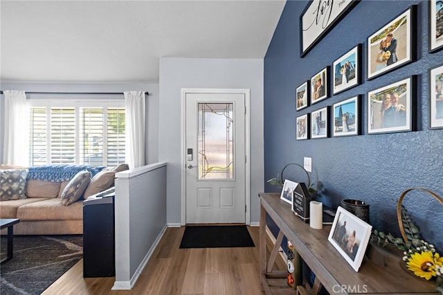13220 February Dr, Corona, CA 92879 - foyer entrance with wood finished floors and baseboards