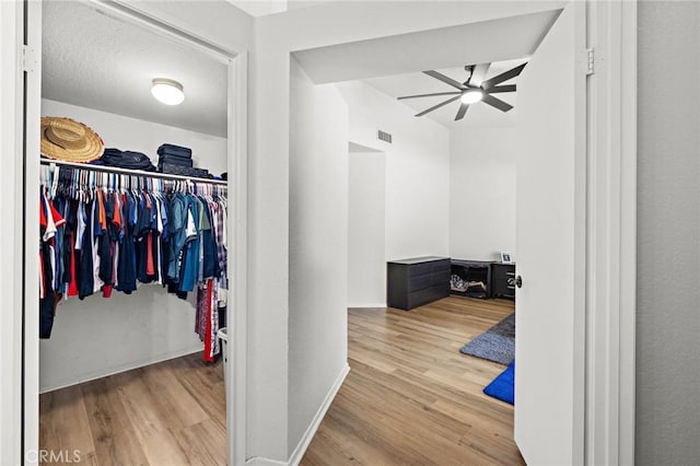 13220 February Dr, Corona, CA 92879 - spacious closet with ceiling fan and wood finished floors