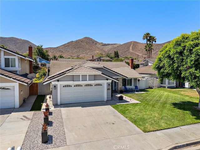 13220 February Dr, Corona, CA 92879 - ranch-style house featuring a tile roof, a garage, driveway, and a mountain view