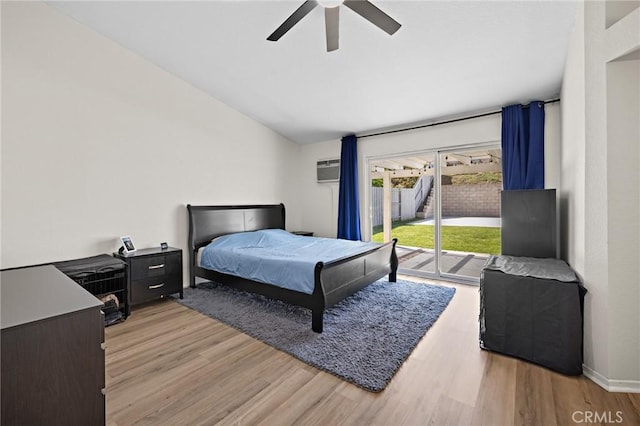 13220 February Dr, Corona, CA 92879 - bedroom featuring access to exterior, lofted ceiling, light wood-style floors, a wall mounted AC, and a ceiling fan