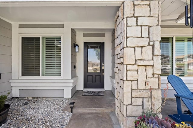 13220 February Dr, Corona, CA 92879 - doorway to property featuring stone siding and covered porch