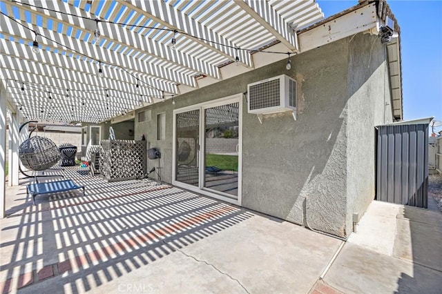 13220 February Dr, Corona, CA 92879 - view of patio featuring a wall mounted AC and a pergola