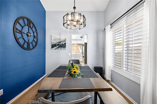 13220 February Dr, Corona, CA 92879 - dining area with wood finished floors and a chandelier