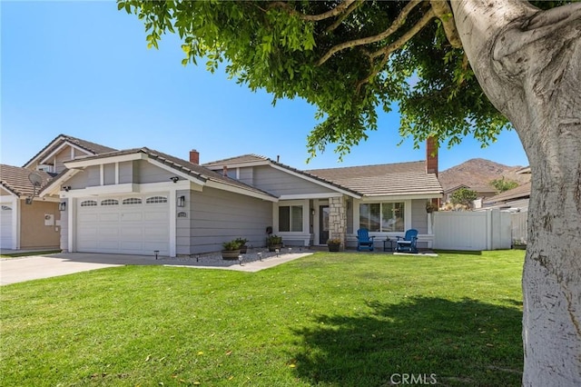 13220 February Dr, Corona, CA 92879 - view of front of house with a chimney, an attached garage, driveway, and a tiled roof