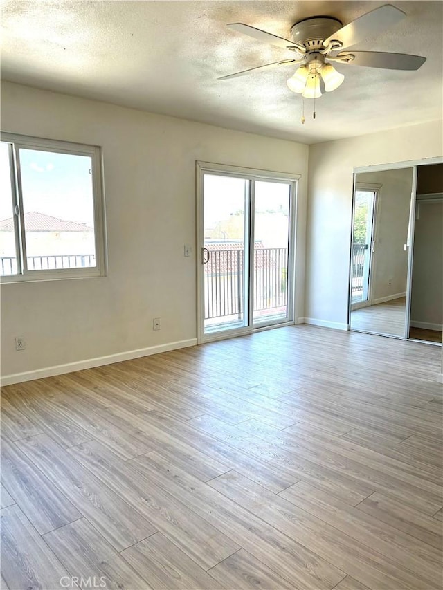 38710 10th St E Unit 12, Palmdale, CA 93550 - spare room with a ceiling fan, light wood finished floors, and a textured ceiling