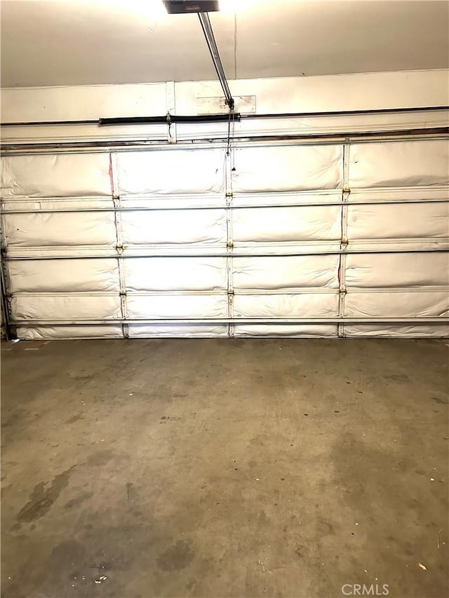 38710 10th St E Unit 12, Palmdale, CA 93550 - garage featuring a garage door opener