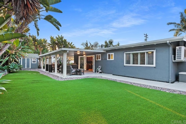 773 Puebla St, Encinitas, CA 92024 - rear view of house with stucco siding, a patio area, a lawn, and an outbuilding