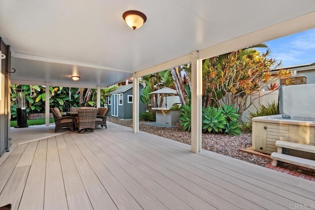 773 Puebla St, Encinitas, CA 92024 - deck featuring a hot tub, outdoor dining space, a storage shed, and a fenced backyard
