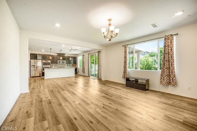 1920 Clementine St, Redlands, CA 92374 - unfurnished living room featuring a chandelier, light wood-type flooring, and recessed lighting