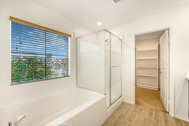 1920 Clementine St, Redlands, CA 92374 - bathroom with a stall shower, a garden tub, and wood finished floors