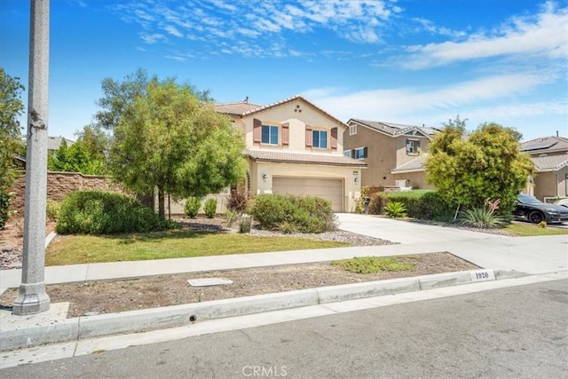 1920 Clementine St, Redlands, CA 92374 - view of front facade featuring an attached garage, a tile roof, concrete driveway, and stucco siding