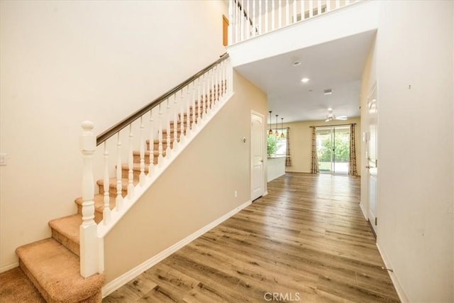 1920 Clementine St, Redlands, CA 92374 - staircase with wood finished floors and a high ceiling