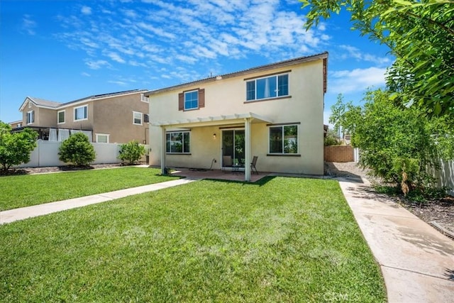 1920 Clementine St, Redlands, CA 92374 - back of house featuring stucco siding, a fenced backyard, and a patio