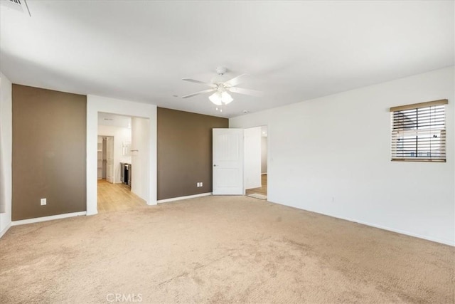 1920 Clementine St, Redlands, CA 92374 - unfurnished bedroom featuring light carpet, ensuite bath, and a ceiling fan