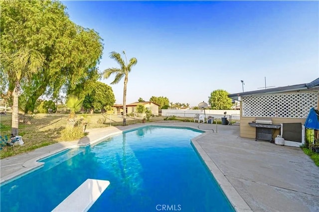 10663 Linden Ave, Bloomington, CA 92316 - view of swimming pool with a fenced backyard, a diving board, area for grilling, and a patio area