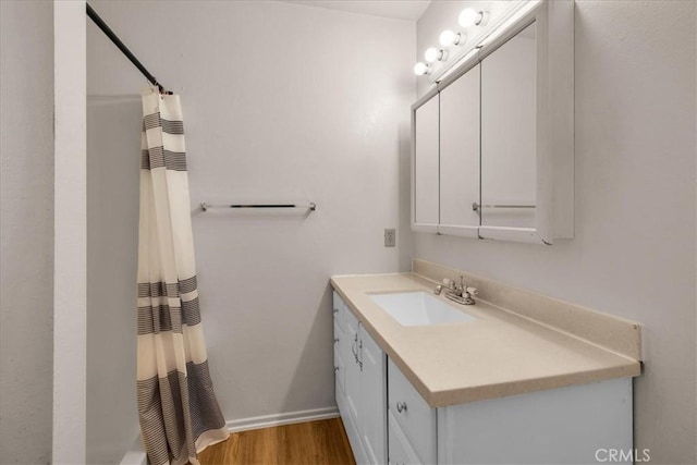 6413 Smoketree Ave Unit 29, Palms, CA 92277 - full bathroom featuring vanity and wood finished floors