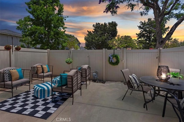 6782 Tahitian Cir, Yorba Linda, CA 92886 - patio terrace at dusk featuring an outdoor living space, a patio, and a fenced backyard