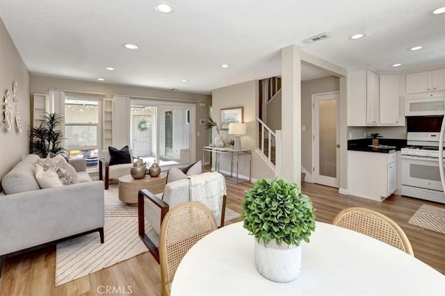 6782 Tahitian Cir, Yorba Linda, CA 92886 - dining area featuring stairway, light wood-style flooring, and recessed lighting