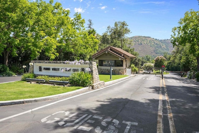 32204 Wiskon Way, Pauma Valley, CA 92061 - view of asphalt road featuring a mountain view, curbs, and a gated entry